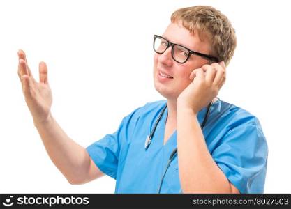Doctor in a blue suit talking on the phone on a white background