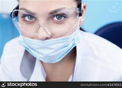 Doctor in a mask and goggles close-up
