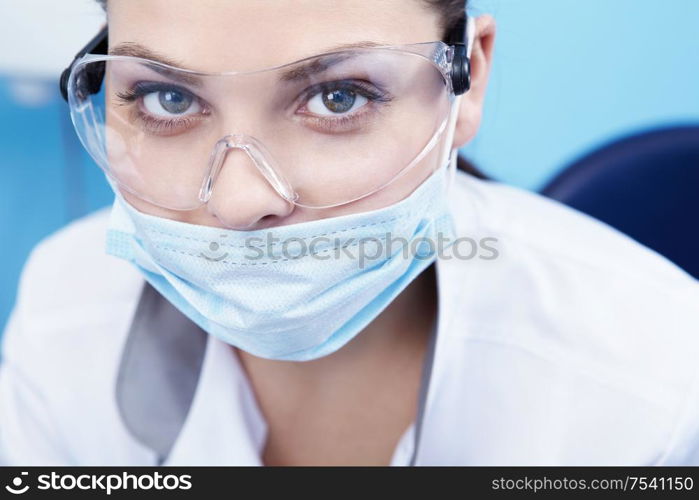 Doctor in a mask and goggles close-up