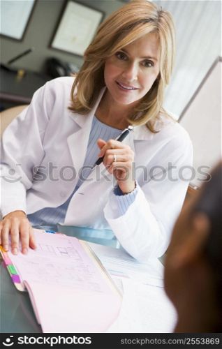 Doctor in consultation with man at IVF clinic (selective focus)