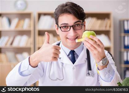 Doctor in dieting concept with fruits and vegetables