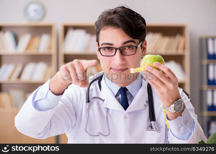 Doctor in dieting concept with fruits and vegetables