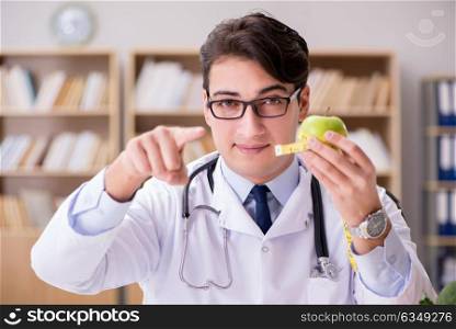 Doctor in dieting concept with fruits and vegetables