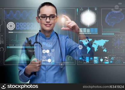 Doctor in futuristic medical concept pressing button