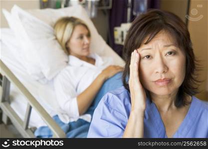 Doctor In Patients Room With Headache