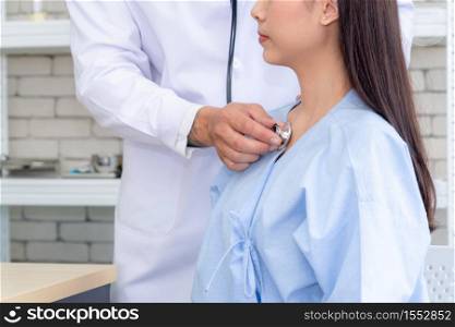 Doctor in professional uniform examining patient at hospital or medical clinic. Health care , medical and doctor staff service concept.