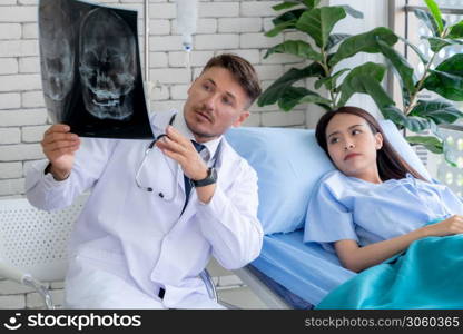 Doctor in professional uniform examining patient at hospital or medical clinic. Health care , medical and doctor staff service concept.