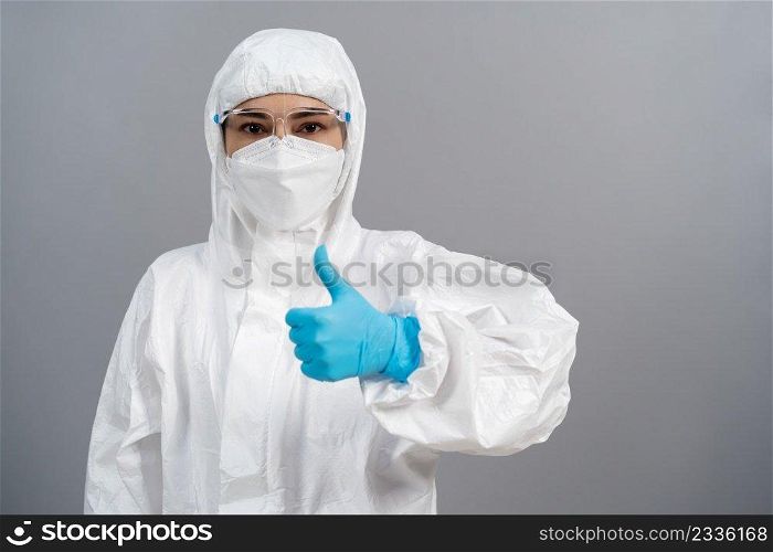 doctor in protective PPE suit doing thump up hand sign