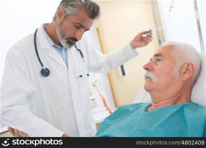 doctor inject liquid to patient