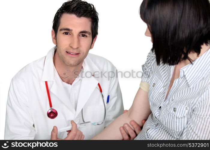 Doctor injecting patient