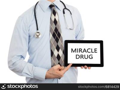 Doctor, isolated on white backgroun, holding digital tablet - Miracle drug