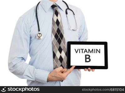 Doctor, isolated on white backgroun, holding digital tablet - Vitamin B