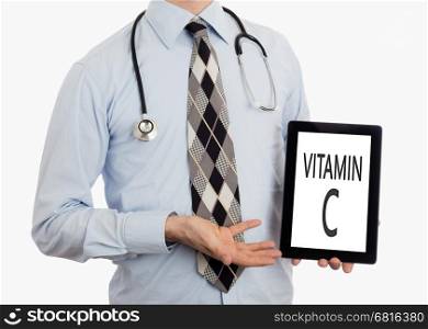 Doctor, isolated on white backgroun, holding digital tablet - Vitamin C