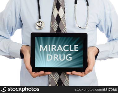 Doctor, isolated on white background, holding digital tablet - Miracle drug