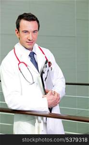 Doctor leaning against railing