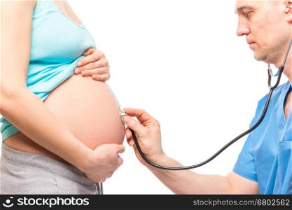 Doctor listening the baby's heartbeat in the belly of a pregnant woman