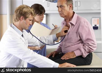 Doctor Listening To Male Patient&#39;s Chest