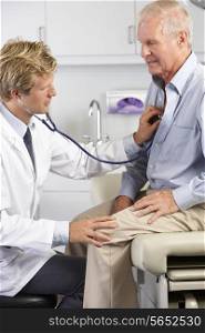 Doctor Listening To Male Patient&#39;s Chest