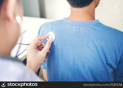 Doctor listening to patients breathing sound with Stethoscope