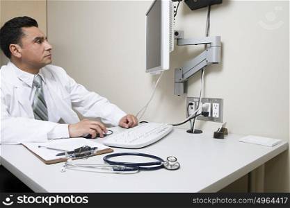 Doctor looking at computer screen