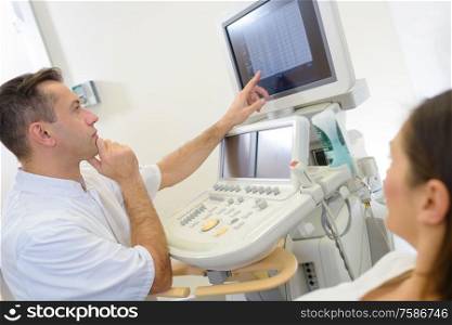 Doctor looking at ultrasound screen