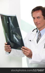 Doctor looking at X-ray