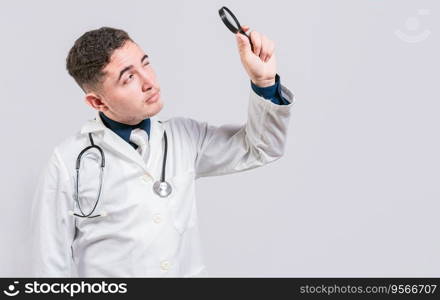 Doctor looking for something with magnifying glass looking isolated. Handsome Doctor holding magnifying glass and looking for something