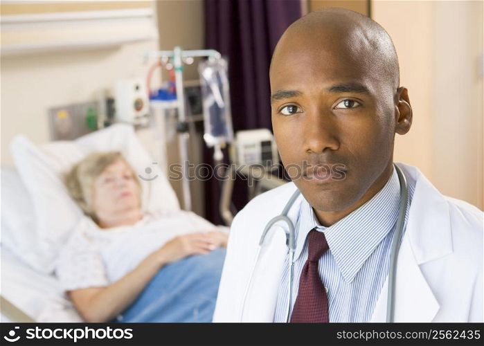 Doctor Looking Serious In Hospital Room,Senior Woman Lying In Hospital Bed
