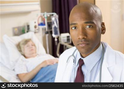 Doctor Looking Serious In Hospital Room,Senior Woman Lying In Hospital Bed
