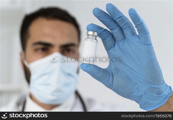 doctor looking vaccine recipient