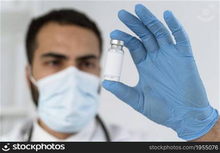 doctor looking vaccine recipient