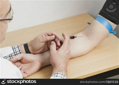 doctor making blood test