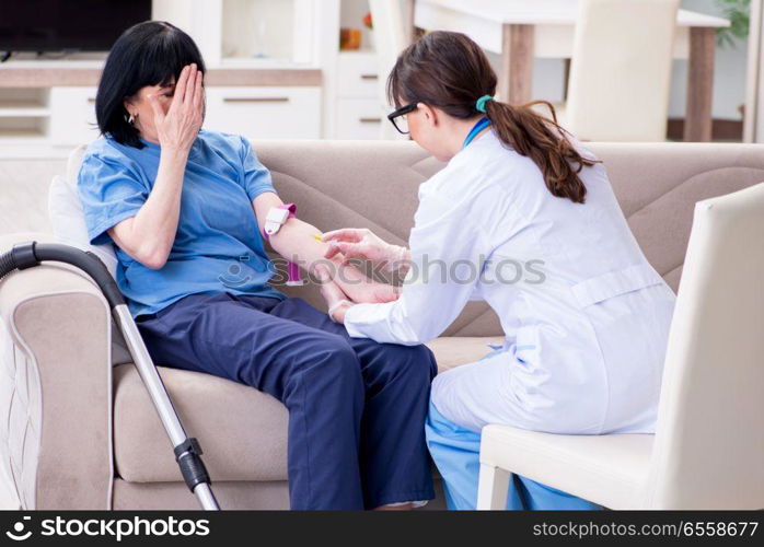 Doctor making injection to senior old woman