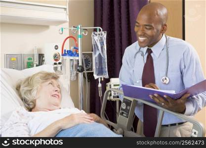 Doctor Making Notes About Patient