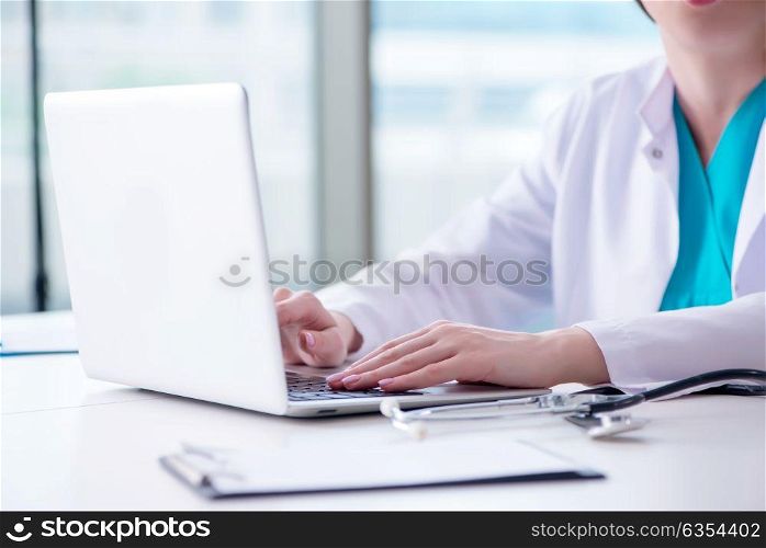 Doctor man working on the computer in lab