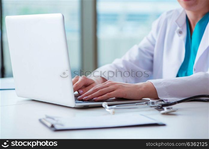 Doctor man working on the computer in lab