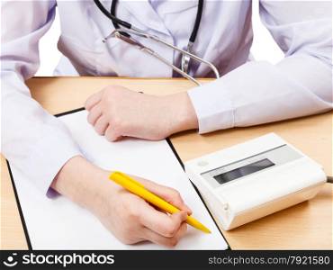doctor measures blood pressure during appointment isolated on white