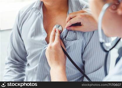 Doctor Measuring arterial blood pressure man patient Health care in hospital