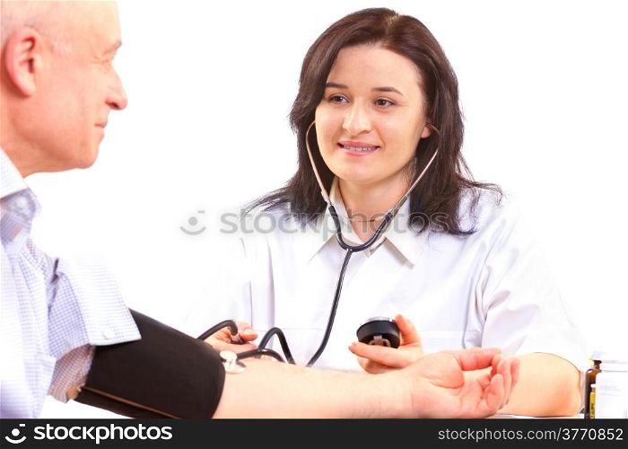 doctor measuring blood pressure of senior man