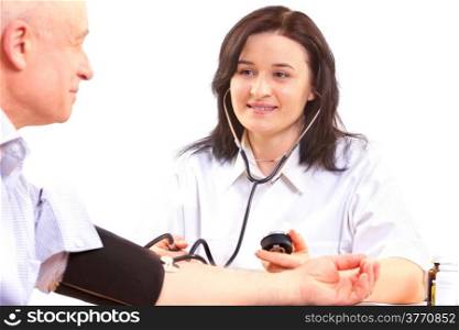 doctor measuring blood pressure of senior man