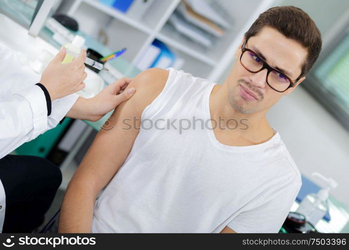 doctor nurse holding a syringe ready an injection
