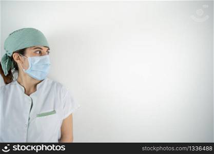Doctor nurse posing in front of the camera with face mask