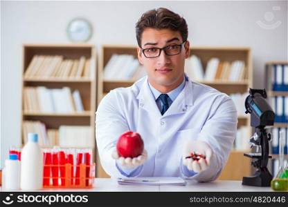 Doctor offering the choice between healthy and vitamins