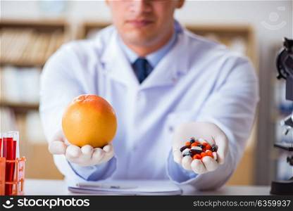 Doctor offering the choice between healthy and vitamins
