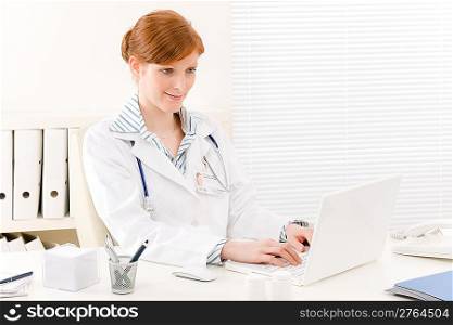 Doctor office - female physician work in front of computer