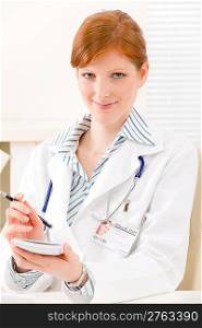 Doctor office - portrait of female physician write prescription