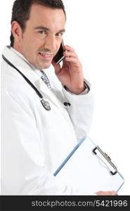 Doctor on phone smiling