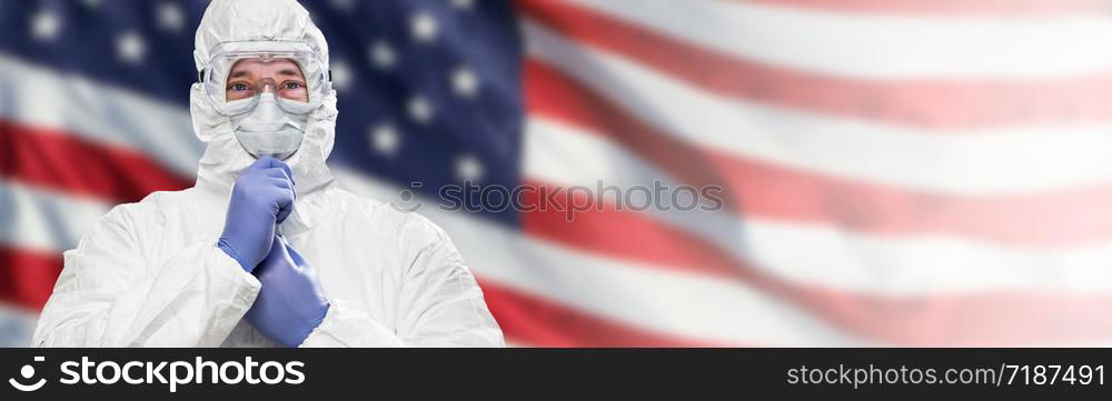 Doctor or Nurse Wearing Medical Personal Protective Equipment (PPE) Against The American Flag Banner.