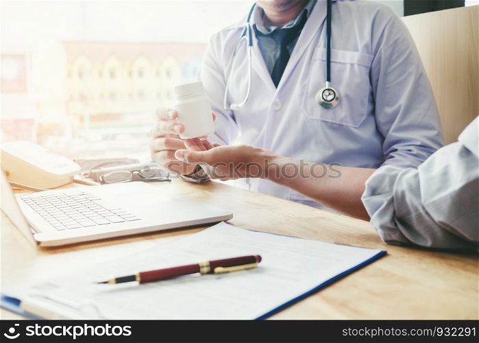 Doctor or physician recommend pills medical prescription to male Patient Doctor or physician recommend pills medical prescription to male Patient