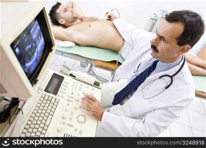 Doctor performing an ultrasound heart scan on young male patient. Real people, real locacion, real image on the screen, not a staged photo with models.